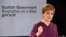 FILE - Scotland's First Minister Nicola Sturgeon gestures as she holds a briefing on the coronavirus outbreak in Edinburgh, March 26, 2020.