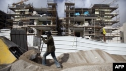 A labourer works at the construction site of a new housing project at the Jewish settlement of Gilo in east Jerusalem, December 20, 2012