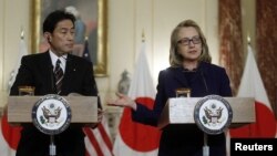 U.S. Secretary of State Hillary Clinton (R) holds a joint news conference with Japan's Foreign Minister Fumio Kishida after their meeting at the State Department in Washington, January 18, 2013.