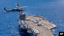 U.S. Navy, the aircraft carrier USS Carl Vinson participates in a group sail during the Rim of the Pacific exercise off the coast of Hawaii. (File)