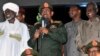 Sudan's President Omar al-Bashir (C) addresses supporters after the army announced it had seized back the town of Abu Kershola from the Sudanese Revolutionary Front, outside the military headquarters in Khartoum, May 27, 2013.