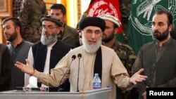FILE - Former Afghan warlord Gulbuddin Hekmatyar speaks to supporters in Jalalabad province, Afghanistan, April 30, 2017. Hekmatyar cautions that a fall of President Ashraf Ghani’s administration would result in Kabul being overrun by the Taliban.