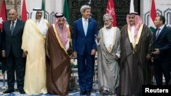 (L to R) Egypt's Foreign Minister is joined by counterparts from Kuwait, Saudi Arabia, the U.S., Oman, Bahrain, and Lebanon at King Abdulaziz International Airport’s Royal Terminal in Jeddah, Sept. 11, 2014. 