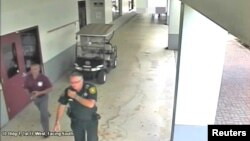 Then-Broward County Sheriff's Deputy Scot Peterson, who was assigned to Marjory Stoneman Douglas High School during the Feb. 14, 2018 shooting, is seen in this still image captured from the school surveillance video released by Broward County Sheriff's Office in Florida.
