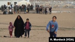 Camp officials say IS families continue to arrive at the Haj Ali camp daily fearing retribution attacks, keeping the camp filled despite the fact that many families that fled IS are going home, Dec. 27, 2017. 