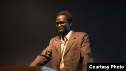 George Washington graduate Makwei Deng speaking to students and supporters. (William Atkins/The George Washington University)