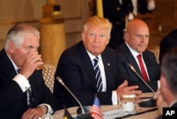 U.S. President Donald Trump, center, sits with then-Secretary of State Rex Tillerson, left, and then-National Security Adviser H.R. McMaster in Brussels, May 24, 2017.