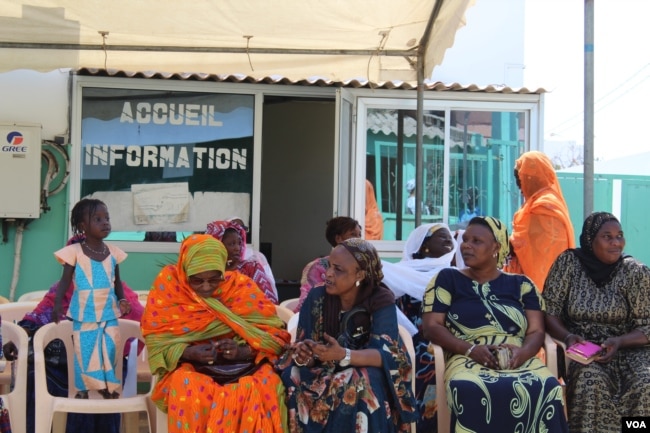 FILE - Women wait outside a health center for free breast and cervical cancer screenings, in Yoff, Dakar, Senegal, April 22, 2017. Officials say Malawi has the world's highest rate of cervical cancer. (S. Christensen/VOA)