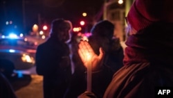 People come to show their support after a shooting occurred in a mosque at the Québec City Islamic cultural center on Sainte-Foy Street in Quebec city on Jan. 29, 2017.