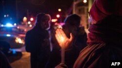 People come to show their support after a shooting occurred in a mosque at the Québec City Islamic cultural center on Sainte-Foy Street in Quebec city on Jan. 29, 2017.