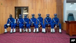 Burkina Faso Police guard the courtroom where 14 people, including former President Blaise Compaore, stand trial as charged with the murder of leader Thomas Sankara, in Ougadougou, Burkina Faso, Oct. 11, 2021