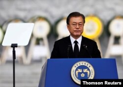 South Korean President Moon Jae-in delivers his speech during a ceremony marking Korean Memorial Day at the National Cemetery in Seoul, South Korea, June 6, 2019.