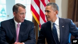 President Barack Obama talks with House Speaker John Boehner of Ohio, prior to speaking to media, in the Cabinet Room of the White House in Washington, Sept. 3, 2013.