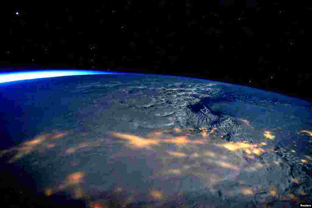 A winter storm affecting the U.S. East Coast is seen in a NASA picture taken from the International Space Station, Jan. 23, 2016. The storm dumped nearly 2 feet (58 cm) of snow on the suburbs of Washington, D.C., before moving on to Philadelphia and New York, paralyzing road, rail and airline travel along the U.S. East Coast.