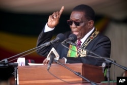 FILE - Zimbabwe's President Emmerson Mnangagwa delivers his speech during his inauguration ceremony at the National Sports Stadium in the capital Harare, Monday, Sept. 4, 2023.