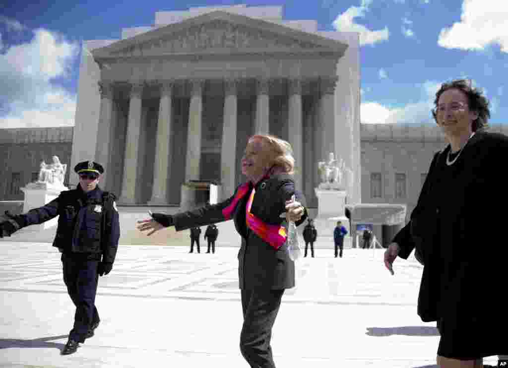 Plaintiff Edith Windsor looks to supporters in front of the Supreme Court in Washington, March 27, 2013. 