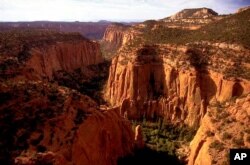 FILE - In this undated file photo, the Upper Gulch section of the Escalante Canyons within Utah's Grand Staircase-Escalante National Monument features sheer sandstone walls, broken occasionally by tributary canyons.