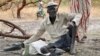 Gatdin Bol, 65, who fled fighting, sits under a tree in the town of Kandak, South Sudan. Five years into the country's civil war, more than 7 million people face severe hunger without food aid, the latest analysis by the U.N. and the government has found. 