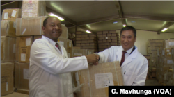 Zimbabwe’s minister of health and child care, Obadiah Moyo, and Indian Ambassador to Zimbabwe Rungsung Masakui in Harare, June 12, 2019, after New Delhi donated drugs worth a-quarter-million dollars to the southern African nation.