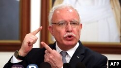FILE - Palestinian Foreign Minister Riad al-Malki speaks during a press conference at the Palestinian embassy in Kuwait City, Kuwait, June 5, 2018.