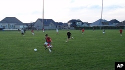 The Woodburn High School boys soccer team practices for an upcoming playoff game.