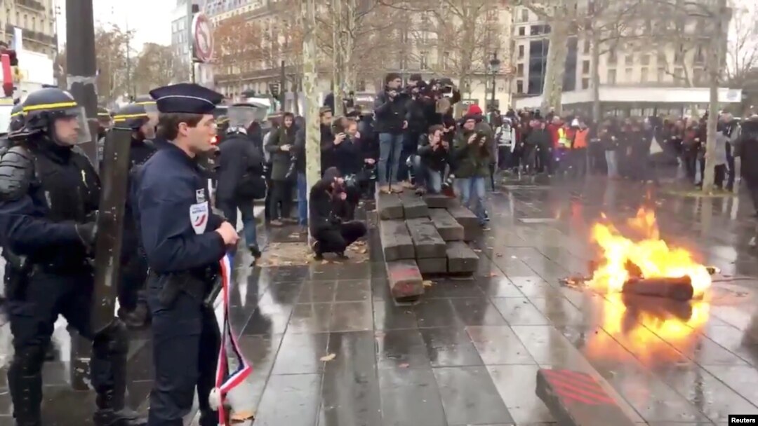 French riot police take position during a protest in Paris, France, Dec. 7, 2018, in this image from video obtained from social media.