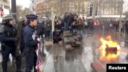 French riot police take position during a protest in Paris, France, Dec. 7, 2018, in this image from video obtained from social media.