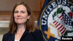 Judge Amy Coney Barrett, President Donald Trump's nominee for the Supreme Court of the United States, poses for a photo with junior United States Senator James Lankford (R-OK) on Capitol Hill in Washington, DC, U.S. October 21, 2020.