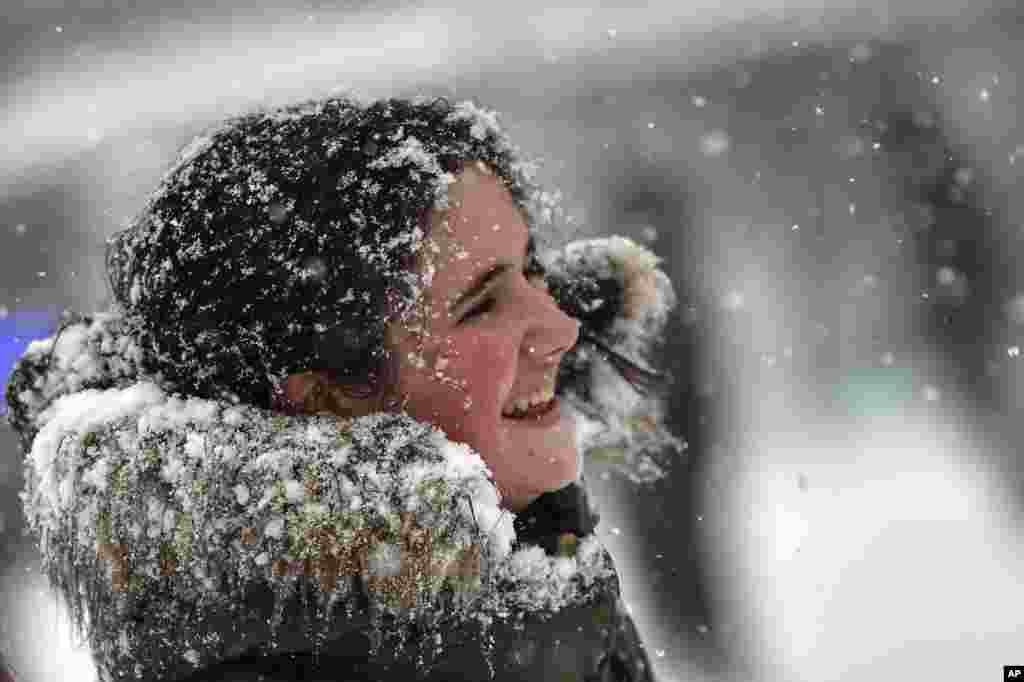 Snow covers a teenager's face in Pamplona northern Spain.