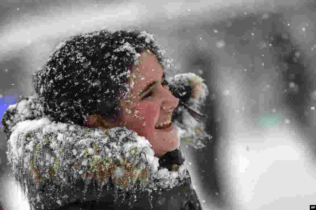 Snow covers a teenager's face in Pamplona, Spain. 