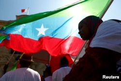 FILE - Members of the Oromo community of Ethiopia, living in Malta, protest against the Ethiopian regime and its plan to displace Oromo farmers outside the office of Malta's Prime Minister in Valletta.