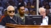 In this photo released by the Extraordinary Chambers in the Courts of Cambodia, the two most senior surviving members of the Khmer Rouge regime Nuon Chea, left, and Khieu Samphan listen to the verdict which upheld their life sentences in Cambodia's top court, Phnom Penh, Cambodia, Nov. 23, 2016.