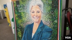 A painting of presumptive presidential nominee Jill Stein is displayed in the registration room at the Green Party's nominating convention in Houston, Aug. 5, 2016. (G. Flakus/VOA)