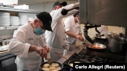 Executive Chef Vito Gnazzo of Il Gattopardo restaurant prepares a smoked mozzarella appetizer.