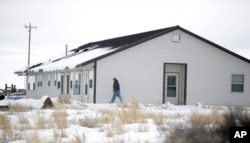 A members of the group occupying the Malheur National Wildlife Refuge headquarters, walks to one of it's buildings, near Burns, Oregon, Jan. 4, 2016.