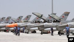 FILE - Dozens of Turkish F-16 jets prepare to take off during Anatolian Eagle exercise at 3rd Main Jet Air Base near the central Anatolian city of Konya.