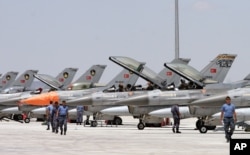 FILE - Dozens of Turkish F-16 jets prepare to take off during Anatolian Eagle exercise at 3rd Main Jet Air Base near the central Anatolian city of Konya.