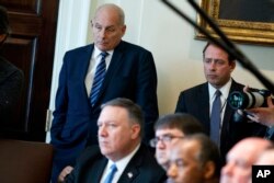 White House Chief of Staff John Kelly listens as President Donald Trump speaks during a cabinet meeting at the White House in Washington, April 9, 2018.