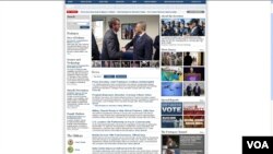 美国防部网页公布卡特 与杨念祖握手照片(美国之音钟辰芳)