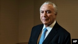 Brazil's President Michel Temer poses for a portrait at Four Seasons Hotel during the 73rd session of the United Nations General Assembly, Sept. 24, 2018, in New York. 