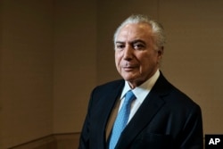 Brazil's President Michel Temer poses for a portrait at Four Seasons Hotel during the 73rd session of the United Nations General Assembly, Sept. 24, 2018, in New York.