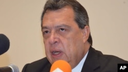 Angel Aguirre, governor of the state of Guerrero announces he’s stepping aside during a press conference in Chilpancingo, Mexico, Thursday Oct. 23, 2014.
