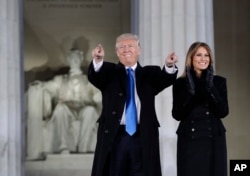 President-elect Donald Trump and his wife Melania Trump arrive at a pre-Inaugural "Make America Great Again! Welcome Celebration" at the Lincoln Memorial in Washington, Thursday, Jan. 19, 2017.