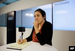 Noa Ovadia takes notes during her debate against the IBM Project Debater in San Francisco, June 18, 2018.