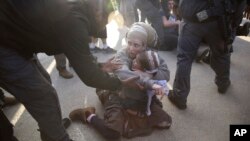 Israeli police evicts settlers from the West Bank settlement of Ofra, following the evacuation of Amona outpost, Feb. 2, 2017.