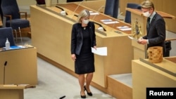 Swedish Prime Minister Magdalena Andersson and Green Party spokesperson Per Bolund take part in a parliamentary debate in Swedish parliament Riksdagen, in Stockholm, Sweden, Jan. 12, 2022. 