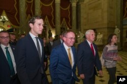 Vice President Mike Pence, second from right, walks with incoming White House Chief of Staff Mick Mulvaney, center, and White House senior adviser Jared Kushner, second from left, after meetings to pass a bill that would pay for President Donald Trump's border wall and avert a partial government shutdown, on Capitol Hill, in Washington, Dec. 21, 2018.