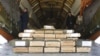 Boxes of ammunition are seen inside a Russian aircraft at the International Kabul Airport, Afghanistan, Feb. 24, 2016. Afghan officials took delivery of 10,000 automatic rifles and millions of rounds of ammunition as a gift from Russia.