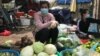 Sok Sreyrath sells produce at Phsar Doeurm Kor market during Cambodia's two-week lockdown, in Phnom Penh, Cambodia, April 15, 2021. (Thida Win/VOA Khmer) 