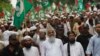 FILE - Sunni cleric Maulana Ahmed Ludhianvi, center, leader of Ahl-e-Sunnat Wal Jamaat (ASWJ), a political and religious group, leads a protest rally in Islamabad, Aug. 22, 2014.